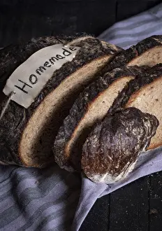 Homemade Pastry Prints: Rye bread sliced on a wooden table