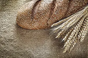 Deserted Bakery Scene Prints: Rye ears bread on burlap background