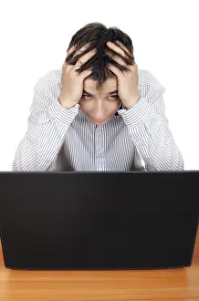 Caucasion Ethnicity Portrait Prints: Sad and Troubled Young Man with Computer