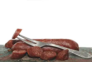 Meat Products Photography Prints: Salami with a fork