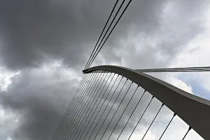 Santiago Calatrava Architecture Prints: Samuel Beckett Bridge, detail of the cable-stayed bridge against a dramatic cloudy sky