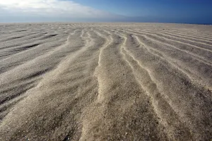 Sandy Ocean Beach Prints: Sand ripple patterns on the beach