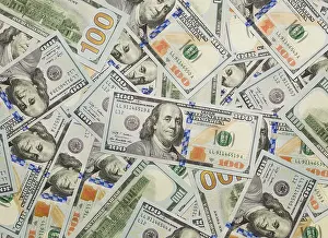 Newly Designed Dollar Bills Prints: Several scattered layer of the newly designed U