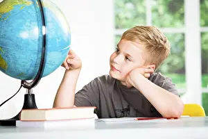 Primary School Homework Prints: A school boy with a globe