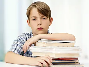 Caucasian Boy Portrait Prints: Schoolboy with a stack of books, looking serious
