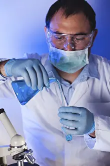 Test Tube Analysis Prints: Scientist is doing research at the work
