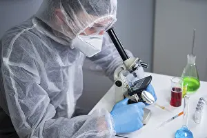 Framed Print : Scientist Examining Sample with Microscope Print Framed Print : Scientist Examining Sample with Microscope Print