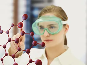 Young Chemist Prints: Scientist pointing to a molecule model