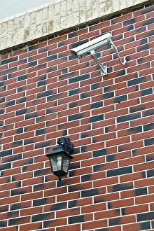 CCTV Camera Installation Prints: Security camera and flashlight on the wall of the house