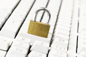 Data Security Concept Prints: Security concept with metal padlock on computer keyboard
