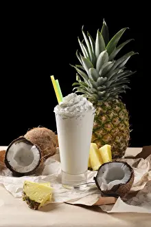 Coconut Cocktail Prints: Selective focus composition with coconut cocktail served with pineapple