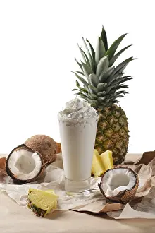 Coconut Cocktail Prints: Selective focus composition with coconut cocktail served with pineapple