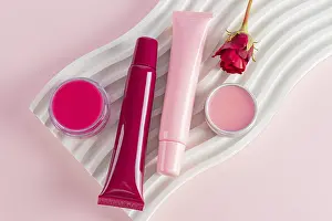 Images Dated 12th August 2024: Natural Care Cosmetic Print: Balm and Lip Gloss Display
