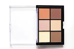 Studio Shot Cosmetics Prints: Set of nude eyeshadows in black case on white background