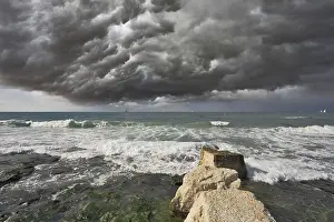 Stormy Mediterranean Sea Prints: Severe storm cloud over the surf