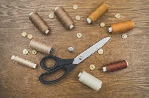 Empty Workshop Scene Prints: Sewing concept. Scissors, threads and buttons
