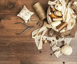 Handicraft Equipment Prints: Sewing concept. Thread spools, buttons and sewing needles