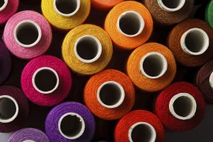 Multicolored Threads Prints: Sewing threads multicolored background closeup