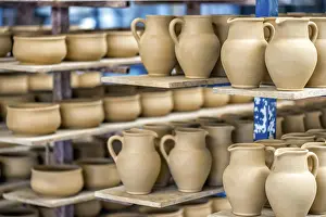 Ceramic Dishware Prints: Shelves with ceramic dishware in pottery workshop