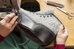 Austrian Shoemaker Prints: Shoemaker, hands sewing with machine finished upper part