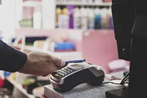 Cashless Transaction Process Prints: Shopper does payment using smartphone