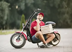 Mountainous Landscape Prints: Full shot delivery guy thinking