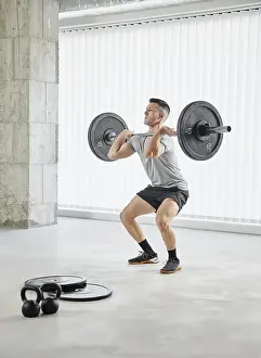 Health Conscious Prints: Full shot man working out with weights