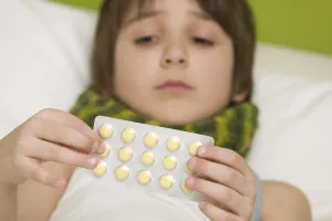Childhood Disease Symptoms Prints: Sick boy taking tablets