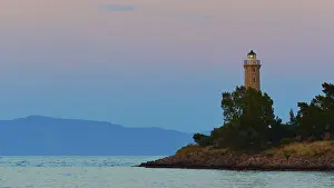 Backlit Lighthouse Photo Prints: Silhouette of a lighthouse at dusk
