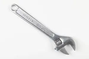 Bright Background Copy Space Prints: A silver adjustable wrench on a white background