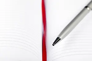 Office Supply Desk Utensils Prints: Silver pen on opened notebook with red string
