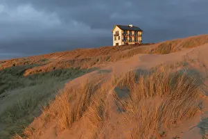 Atmospheric Evening Sky Prints: Single house on the dune in the evening light