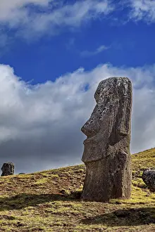 Pacific Ocean Statues Prints: A single moai against a blue sky with clouds on Easter Island