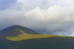 Cloudy Mountain Landscape Prints: A single mountain covered by clouds