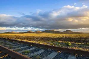 Prints of Single railway track at sunset, Central Bohemian Uplands, Czech Republic. Railway track in nature park Central Bohemian Highlands, Czech Republic Railway Prints: Central Bohemian Uplands Railway Track Print at Sunset