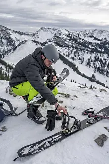 Ski Touring In Germany Prints: Ski tourers, man assembles his splitboard