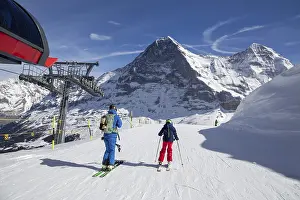 Skiing In Switzerland Prints: Skiing against the backdrop of the north face of the Eiger in Grindelwald