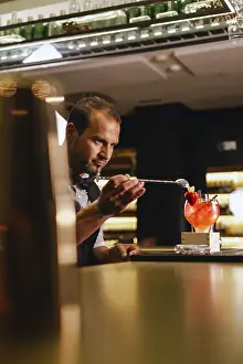 Strawberry Cocktail Recipe Prints: A skilled bartender creates a cocktail