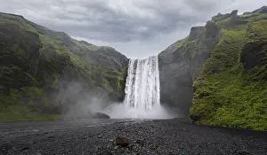 Deserted Waterfall In Iceland Prints: Skogafoss waterfall in dramatic mood