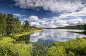 Prints of Sky and clouds reflected in lake, forest tundra, Lappi, Finland Lake Prints: Sky and clouds reflected in lake Print, Lappi, Finland