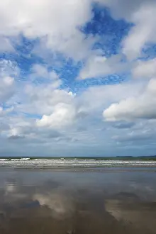 French Coastal Scenery Prints: Sky and clouds are reflected on the surface of a calm beach