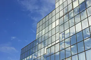 Modern Skyscraper Architecture Prints: Sky and skyscraper building with reflection of sky and clouds