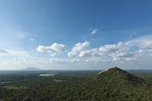 Cloudy Mountain Peaks Prints: Sky above small mountains, covered with trees