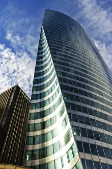 Contemporary Urban Landscape Prints: Skyscraper under cloudy blue sky