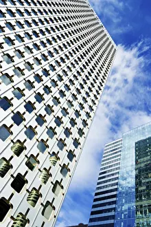 Blue Sky Cityscape Prints: Skyscraper under cloudy blue sky