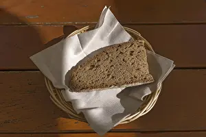 Bread Roll Nutrition Facts Prints: A slice of bread in a bread basket with napkin