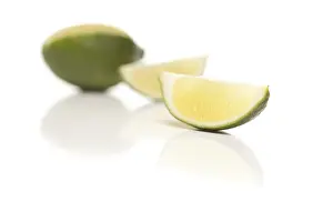 Healthy Food Images Prints: Sliced lime on a reflective white surface