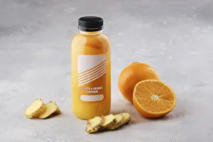 Table Decoration Ideas Prints: Small bottle with orange and ginger lemonade on the table