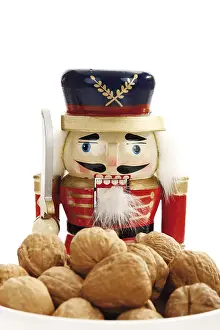 Walnut Nutrition Facts Prints: Small bowl of walnuts with a nutcracker figure