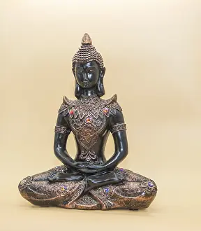 Buddhist Figure Prints: Small buddha image isolated on light background